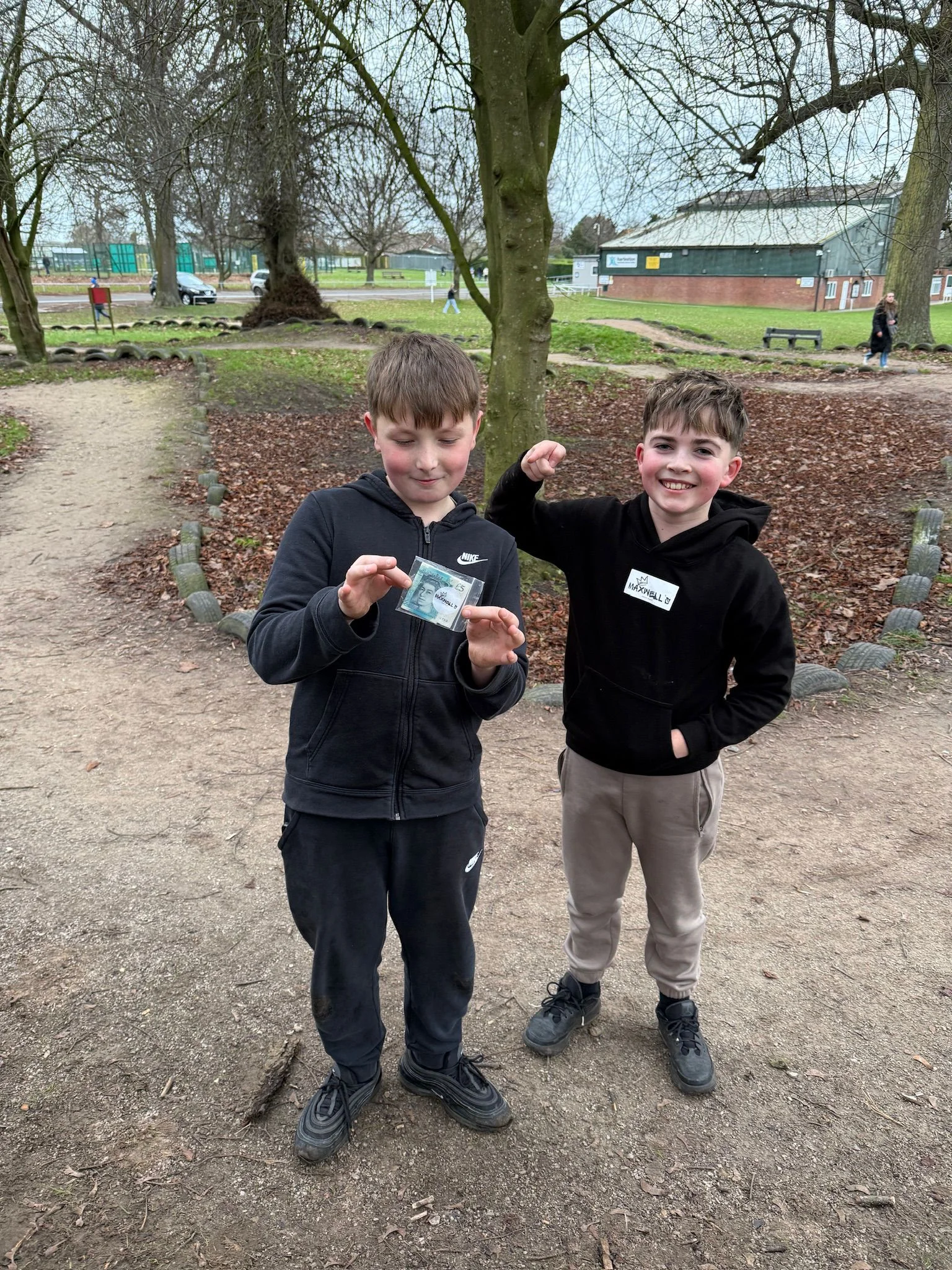 Kid holding money prize